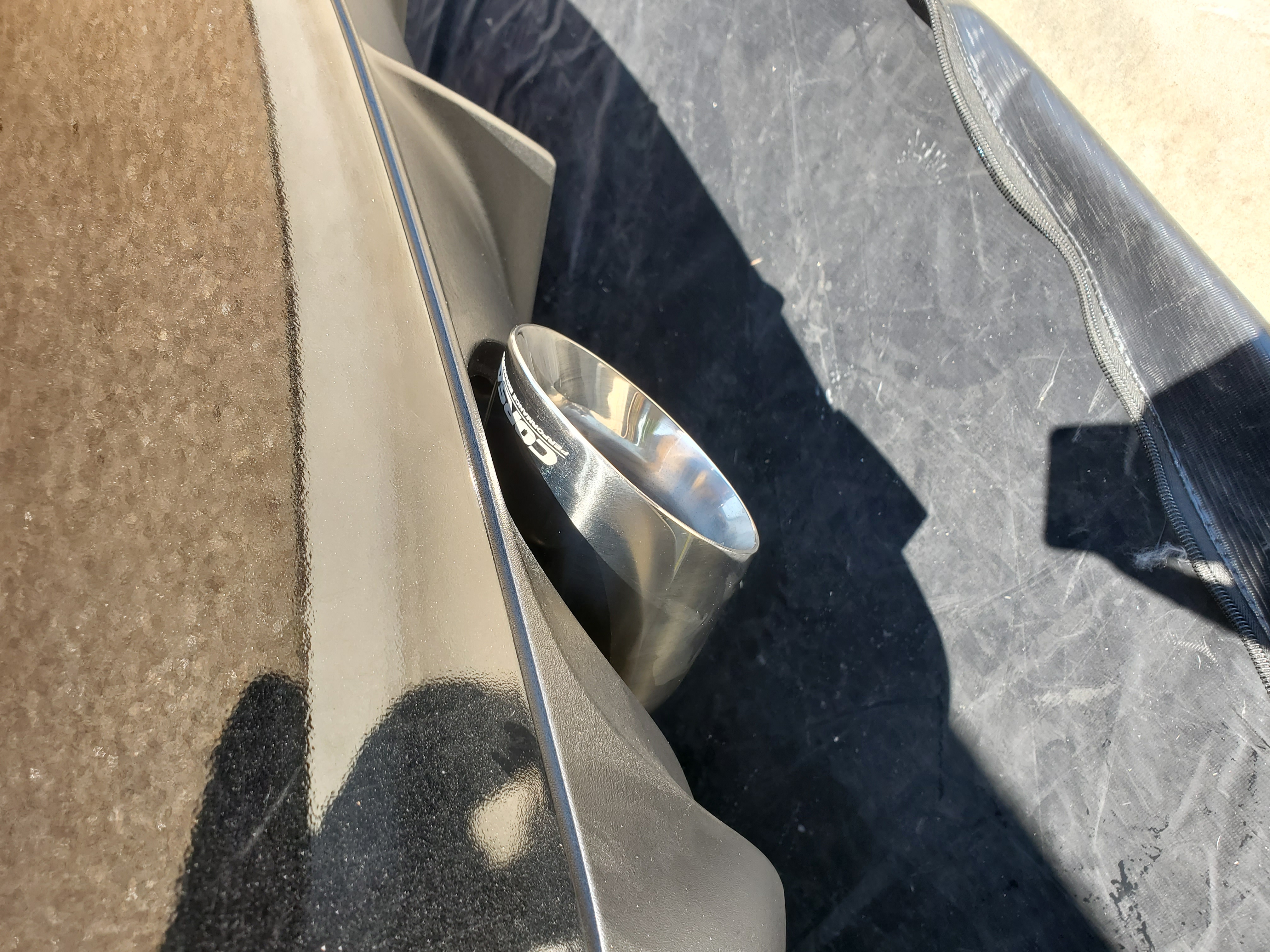 Close-up of installed Corsa tip — passenger side
